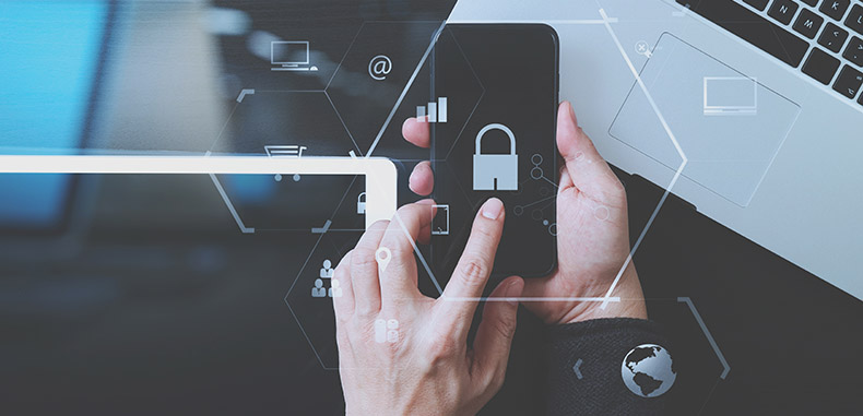 cyber security internet and networking concept.Businessman hand working with VR screen padlock icon mobile phone on laptop computer and digital tablet